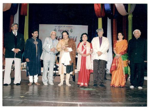 Multiple people standing on a stage