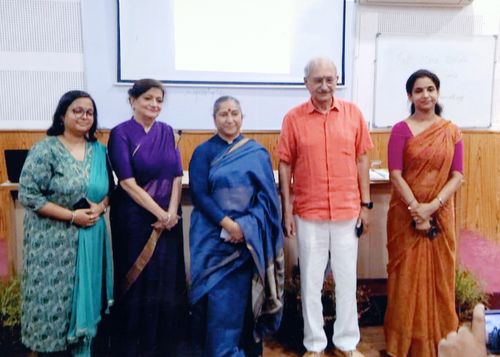 Mrs. Lalita Nijhawan standing with Mr. Lalit Mohan Kapoor and other guests