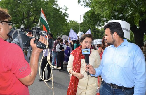 Mrs. Lalita Nijhawan talking to a news reporter