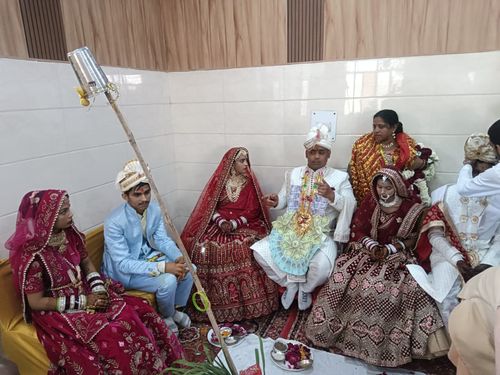 Brides and grooms sitting in the marriage ceremony
