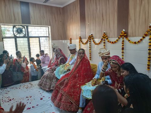 Brides and grooms sitting in the marriage ceremony