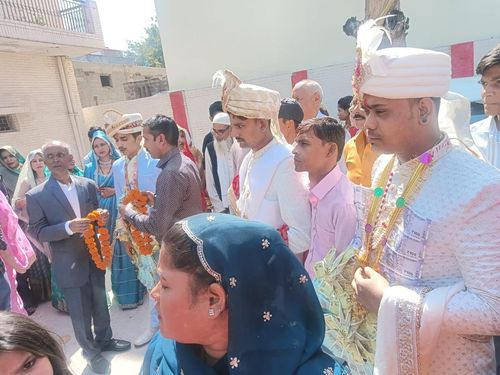Grooms being welcomed at the marriage venue