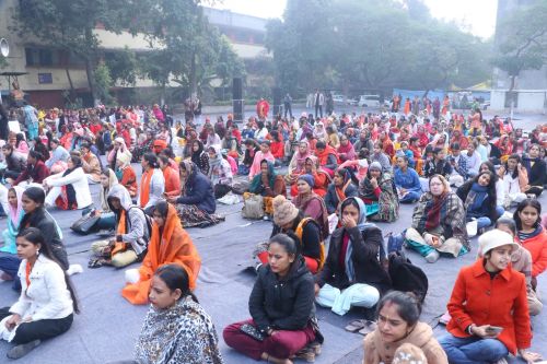 Women participants sitting on the ground