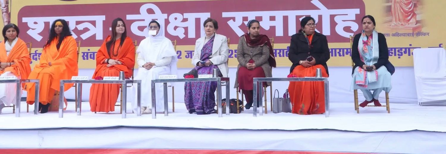 Mrs. Lalita Nijhawan and other dignatories sitting on the stage